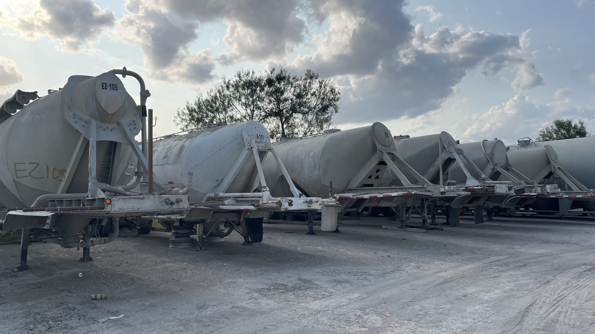 Pneumatic cement tankers lined up in the Eazy Trans yard in Von Ormy, Texas