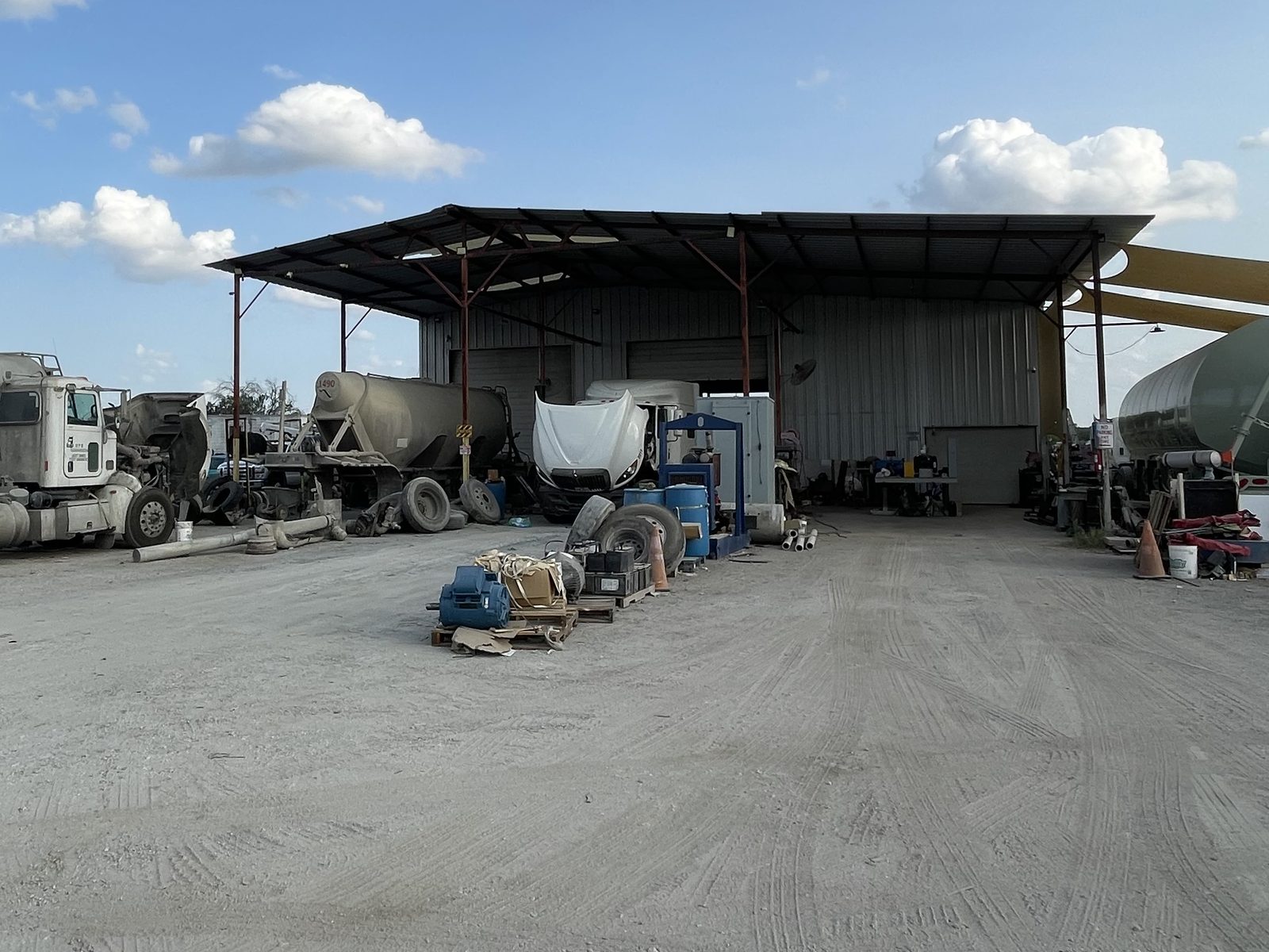 Tractors and trailers under maintenance at the Eazy Trans shop